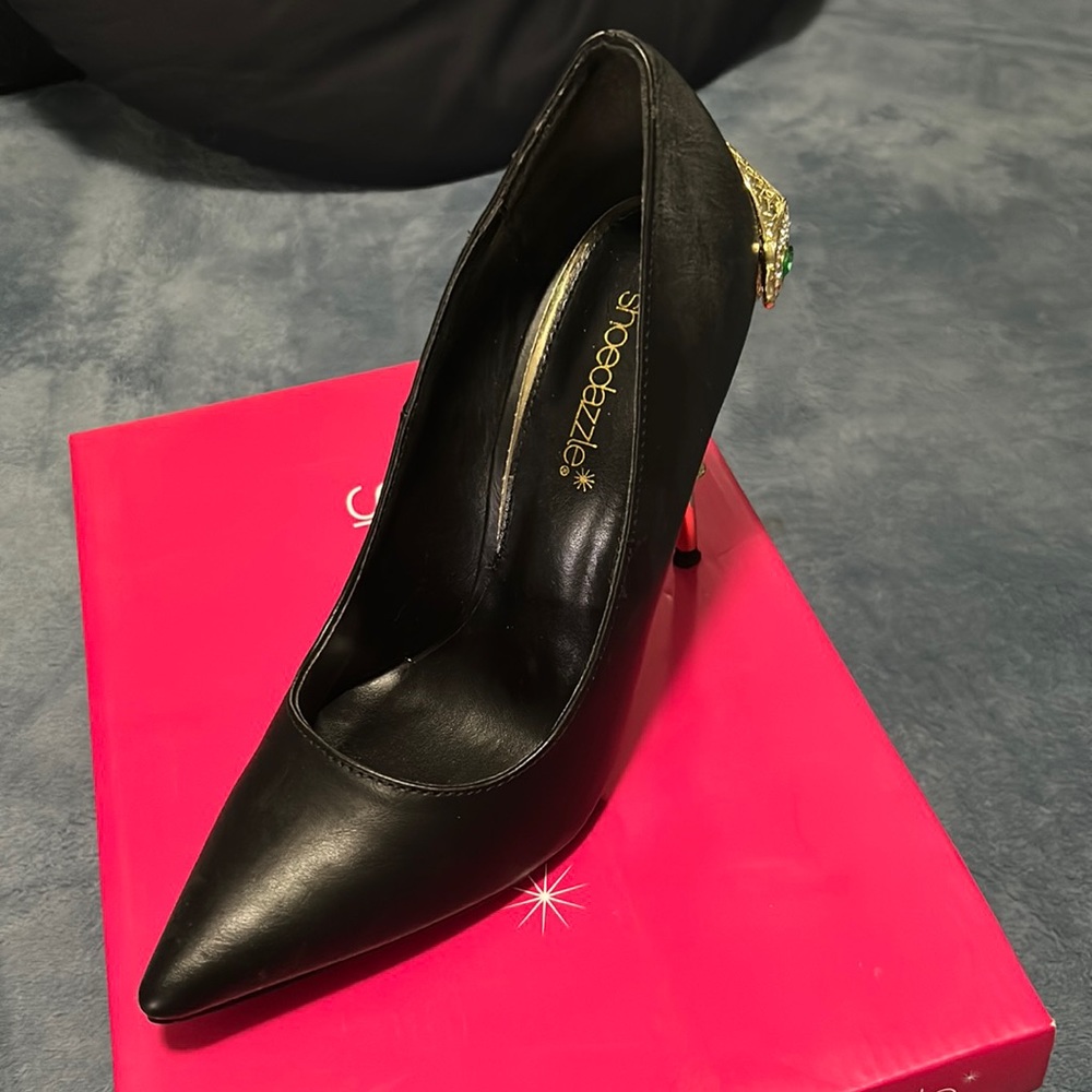 Black heels with gold snake details